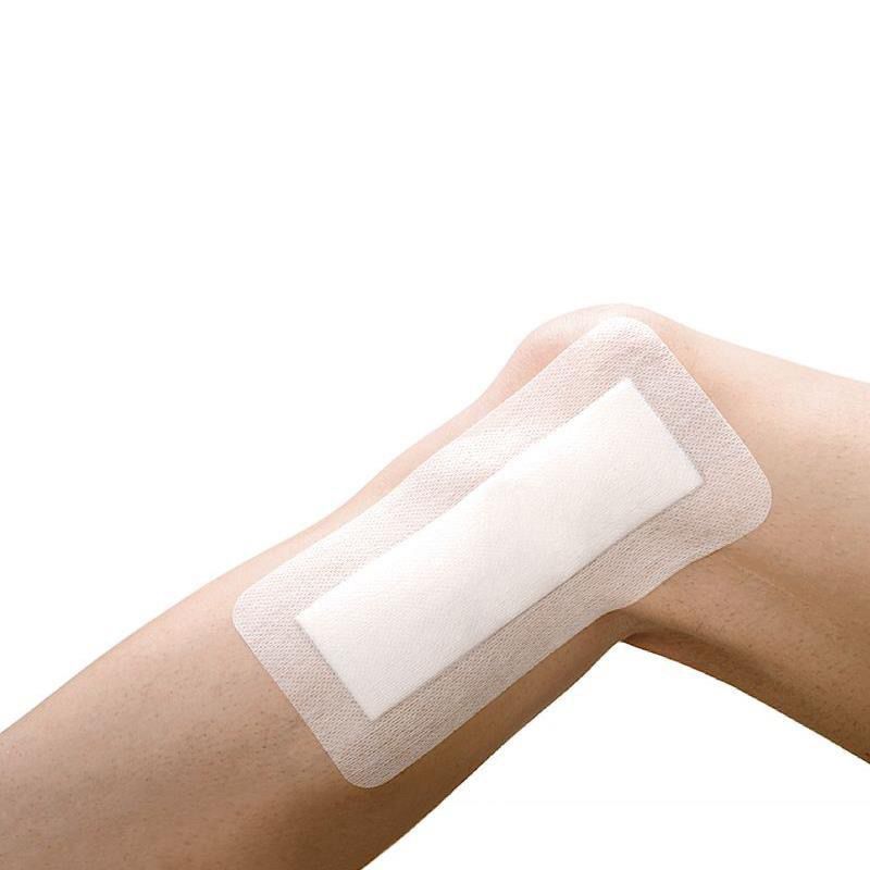 Is it safe to use waterproof adhesive tapes or seals over my bandages?